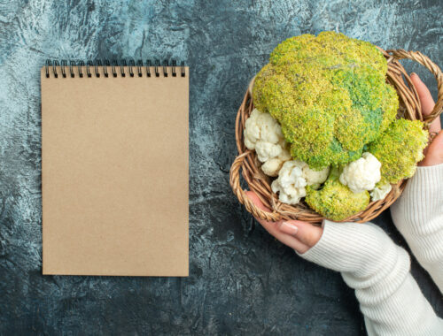 top-view-fresh-cauliflower-inside-basket-light-grey-table
