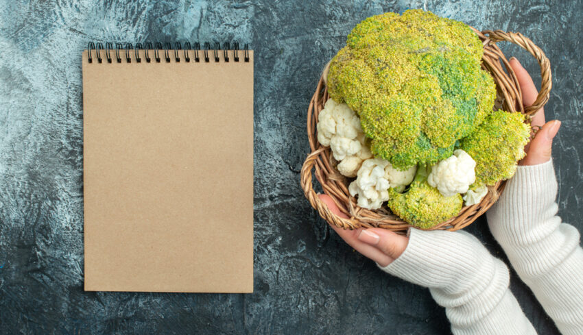 top-view-fresh-cauliflower-inside-basket-light-grey-table